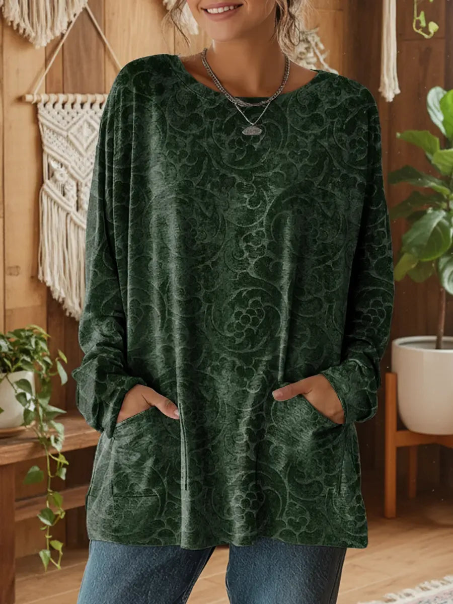 Elegancki i wygodny, ciemnozielony sweter kaszmirowy ozdobiony kwiatowym wzorem, z okrągłym dekoltem i kieszeniami.