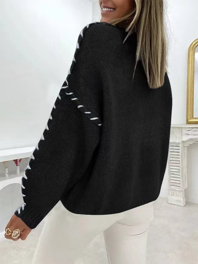 Elegancki i wygodny sweter w jednolitym kolorze z okrągłym dekoltem i teksturowanymi, tkanymi rękawami