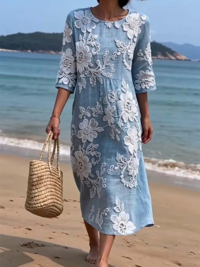 Ta wygodna sukienka bez rękawów, ozdobiona białym kwiatowym nadrukiem, emanuje wyrafinowanym i eleganckim stylem.