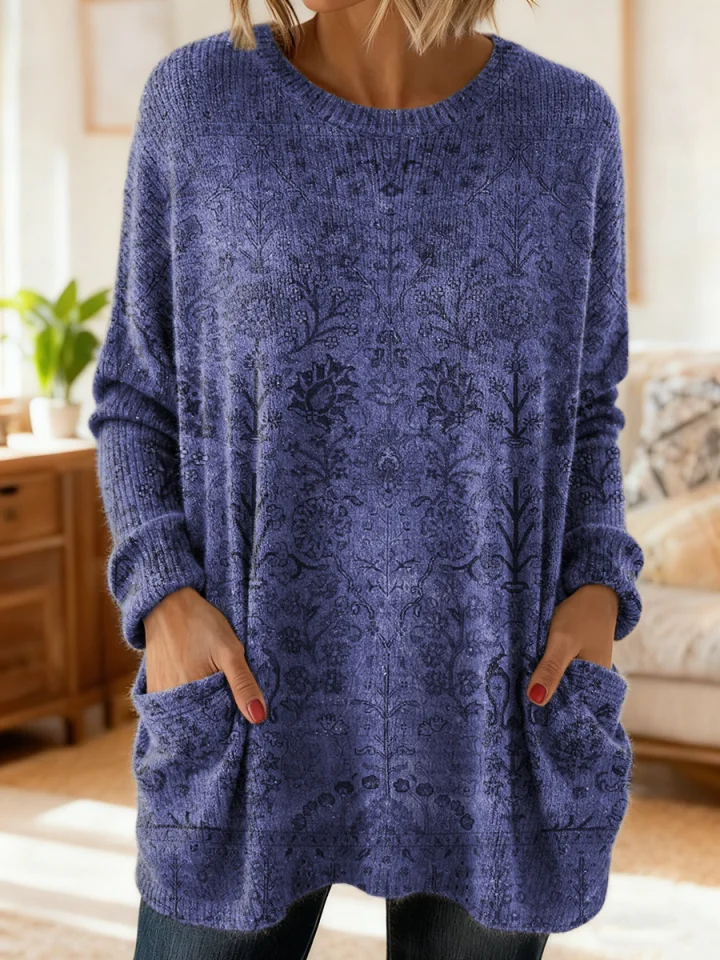 Elegancki i wygodny sweter kaszmirowy z kwiatowym nadrukiem, okrągłym dekoltem i kieszeniami.