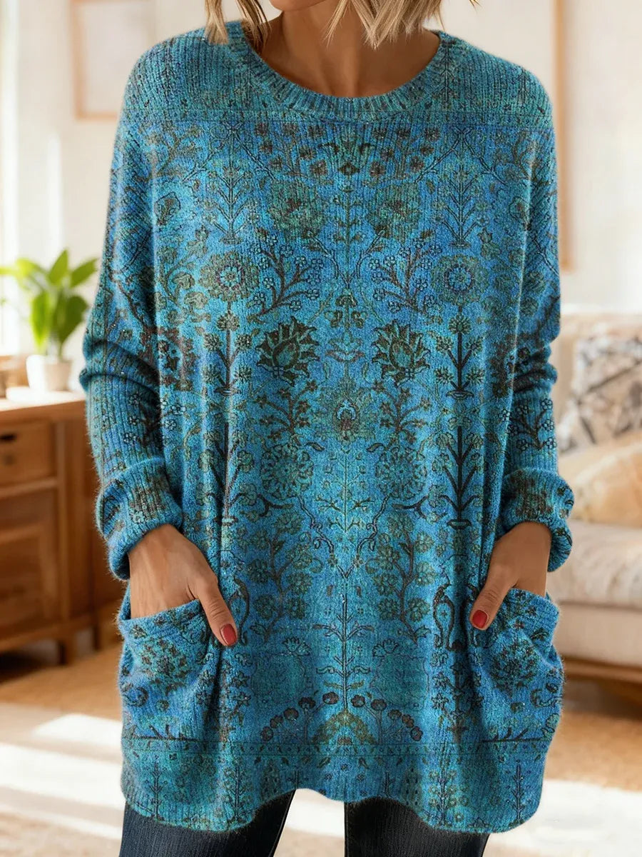 Elegancki i wygodny sweter kaszmirowy z kwiatowym nadrukiem, okrągłym dekoltem i kieszeniami.