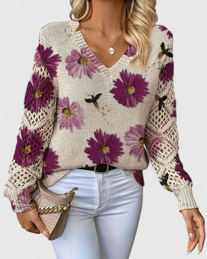 Elegancki i luksusowy top sweter dzianinowy w stylu boho z kwiatowym wzorem, dekoltem w serek, długimi rękawami i ażurowymi rękawami.