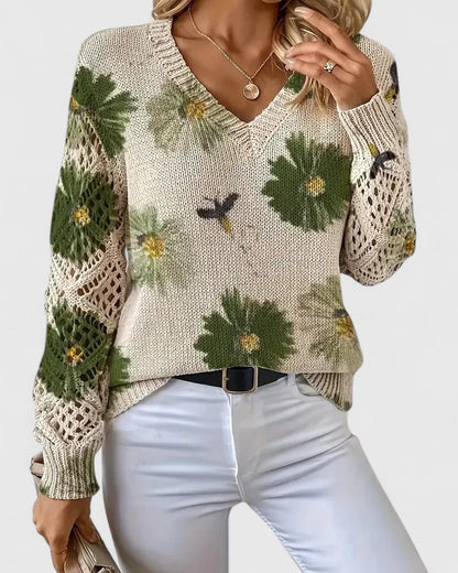 Elegancki i luksusowy top sweter dzianinowy w stylu boho z kwiatowym wzorem, dekoltem w serek, długimi rękawami i ażurowymi rękawami.