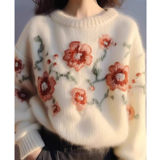 Elegancki i wygodny sweter w kolorze morelowym z okrągłym dekoltem i haftowanym wzorem kwiatowym