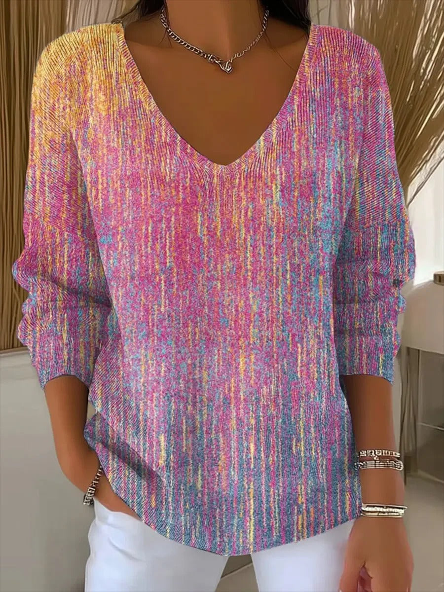 Elegancki i wygodny sweter z długim rękawem w kolorze fioletowym z blokami kolorów i dekoltem w serek.