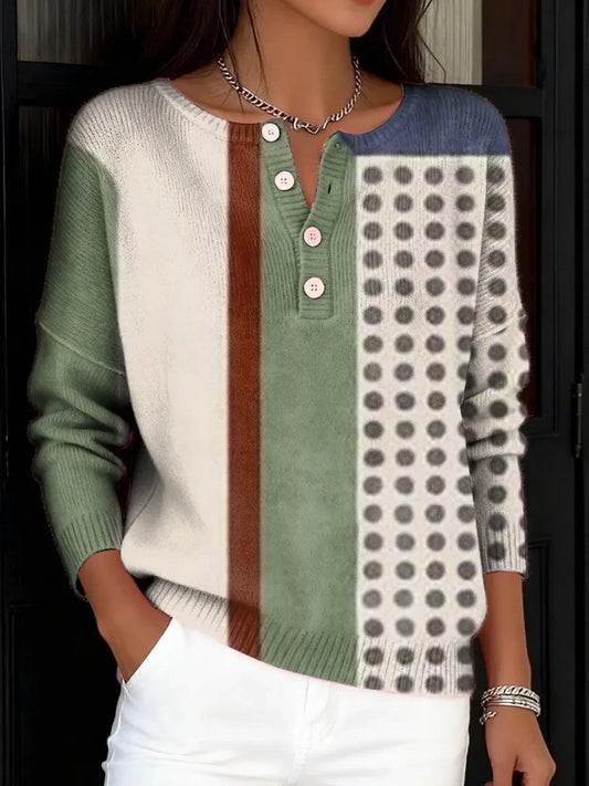 Elegancki i wygodny sweter w bloki kolorystyczne, ozdobiony nieregularnymi geometrycznymi nadrukami i częściowo otwartym dekoltem.