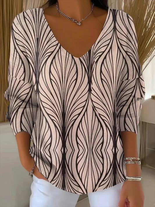 Elegancki i wygodny różowy sweter z długim rękawem, ozdobiony nieregularnym wzorem i dekoltem w serek.