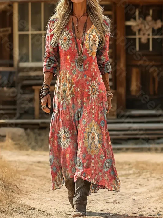 Elegancka i wygodna sukienka w kolorze brzoskwiniowo-różowym z dekoltem w serek, ozdobiona pięknym kwiatowym nadrukiem.