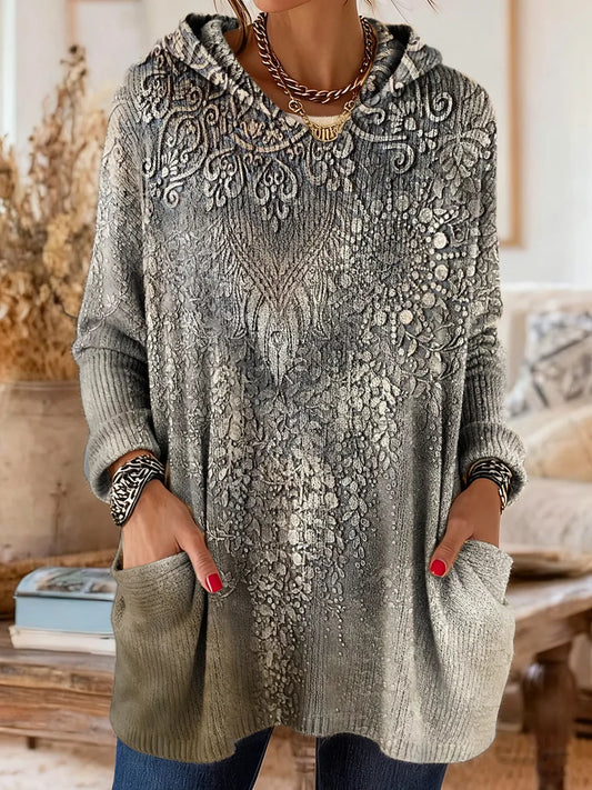 Elegancki i wygodny szary sweter kaszmirowy ozdobiony etnicznym nadrukiem kwiatowym, z kapturem i kieszeniami.