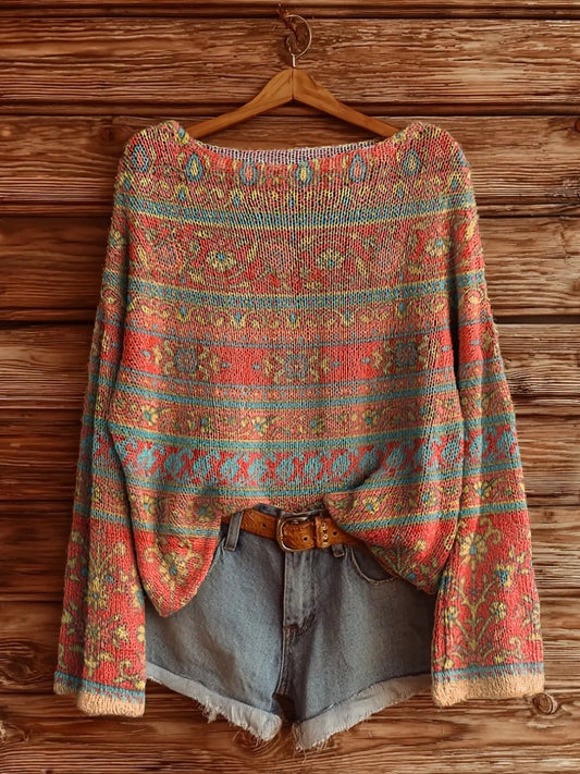 Elegancki i wygodny sweter z długim rękawem i okrągłym dekoltem, w wielokolorowe paski i kwiatowy wzór.