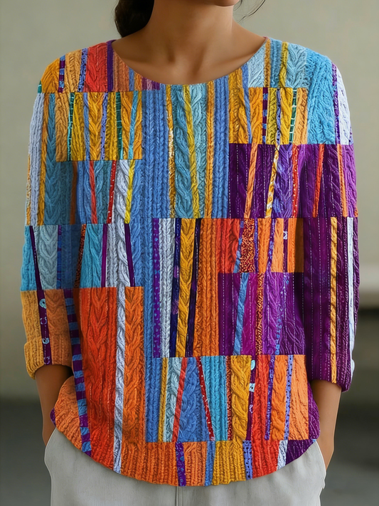 Elegancki i wygodny sweter z okrągłym dekoltem, w jaskrawych kolorach, ze wzorem w pionowe paski, miękki w dotyku.