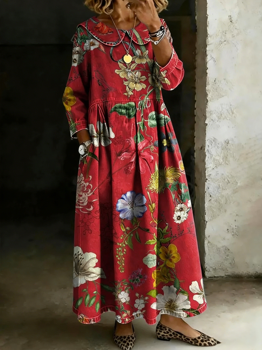 Luźna i wygodna czerwona sukienka wykonana z mieszanki bawełny i lnu, ozdobiona kolorowym nadrukiem.