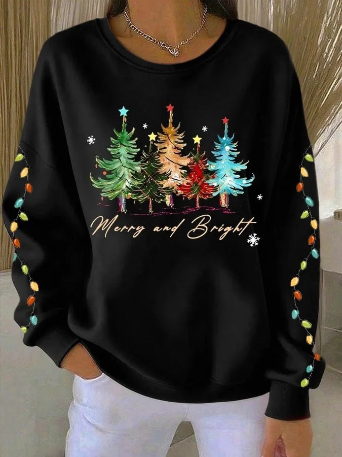 Elegancka i wygodna bluza w jednolitym kolorze, ozdobiona wzorem choinki.