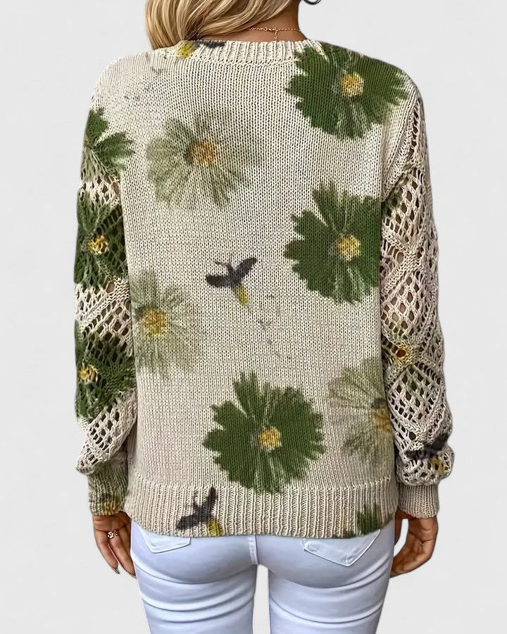 Elegancki i luksusowy top sweter dzianinowy w stylu boho z kwiatowym wzorem, dekoltem w serek, długimi rękawami i ażurowymi rękawami.