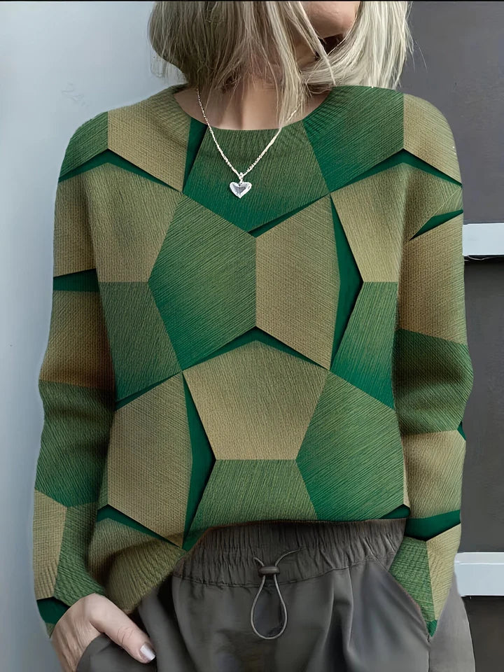 Elegancki i wygodny sweter z okrągłym dekoltem, ozdobiony kolorowymi, nieregularnymi wzorami geometrycznymi; uniwersalny styl.