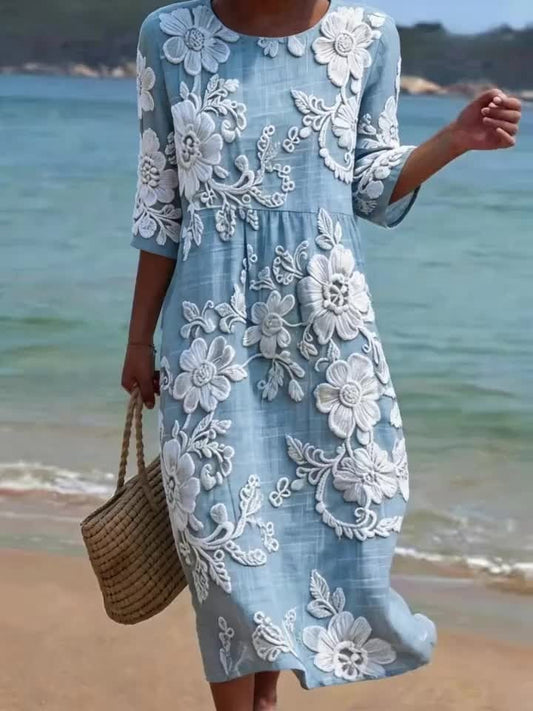 Ta wygodna sukienka bez rękawów, ozdobiona białym kwiatowym nadrukiem, emanuje wyrafinowanym i eleganckim stylem.