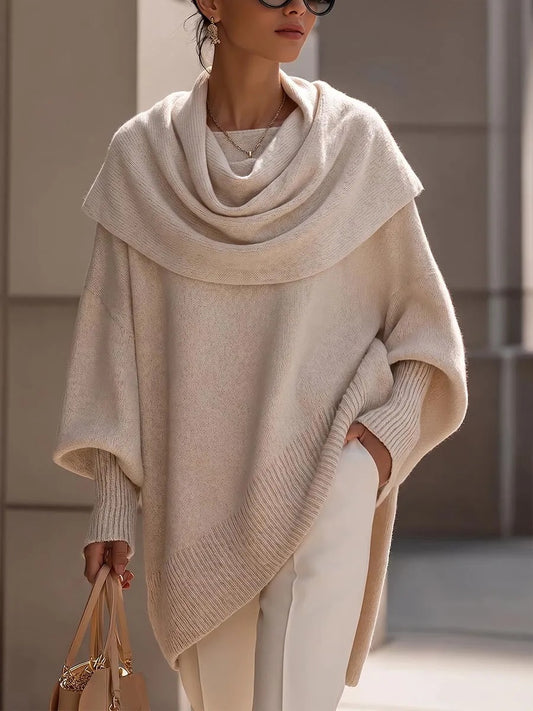 Ten elegancki i wygodny sweter z dzianiny kaszmirowej wyróżnia się wielowarstwowym kołnierzykiem, dzięki czemu zapewnia zarówno swobodny, jak i stylowy wygląd.