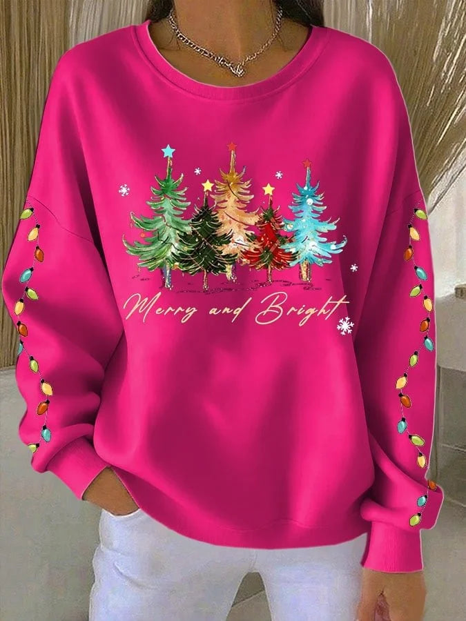 Elegancka i wygodna bluza w jednolitym kolorze, ozdobiona wzorem choinki.