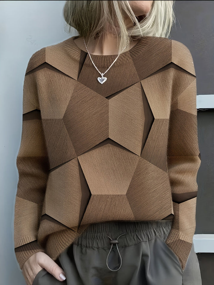 Elegancki i wygodny sweter z okrągłym dekoltem, ozdobiony kolorowymi, nieregularnymi wzorami geometrycznymi; uniwersalny styl.