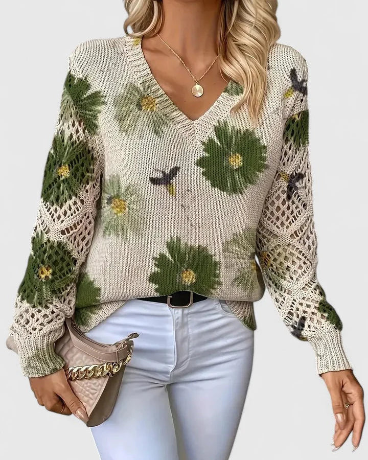 Elegancki i luksusowy top sweter dzianinowy w stylu boho z kwiatowym wzorem, dekoltem w serek, długimi rękawami i ażurowymi rękawami.