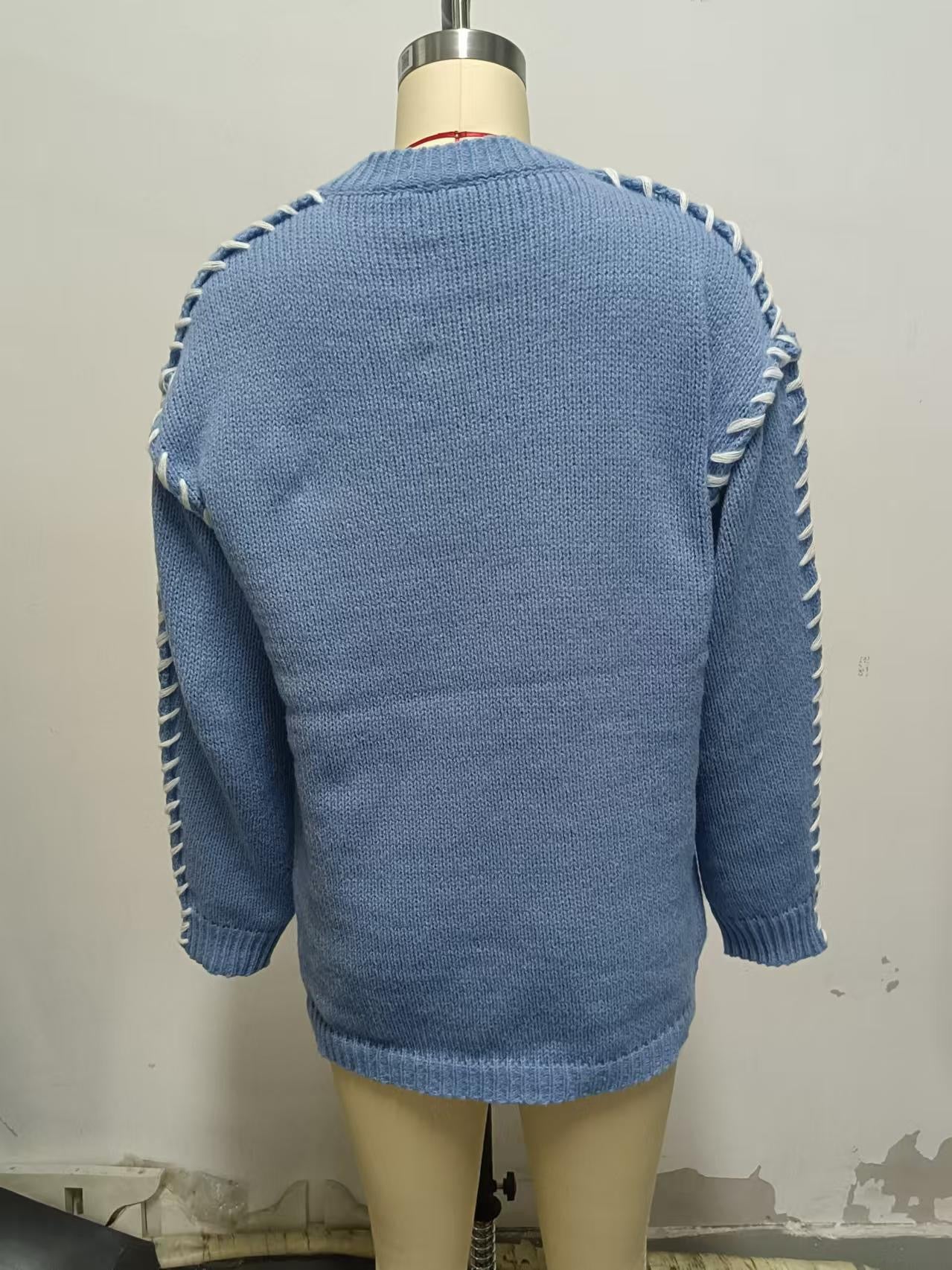 Elegancki i wygodny sweter w jednolitym kolorze z okrągłym dekoltem i teksturowanymi, tkanymi rękawami