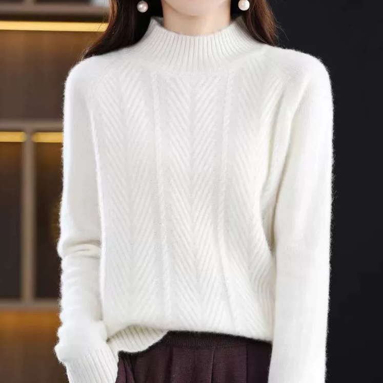 Elegancki i wygodny golf w jednolitym kolorze, ozdobiony tkanym, skręconym wzorem.