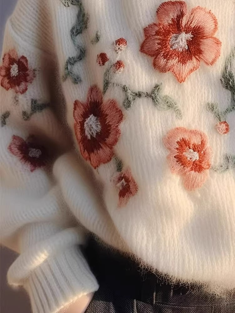 Elegancki i wygodny sweter w kolorze morelowym z okrągłym dekoltem i haftowanym wzorem kwiatowym