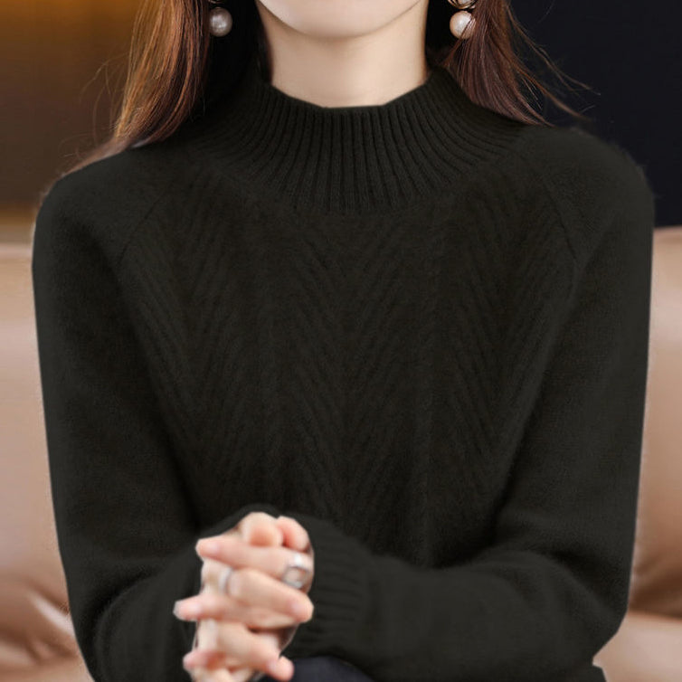 Elegancki i wygodny golf w jednolitym kolorze, ozdobiony tkanym, skręconym wzorem.