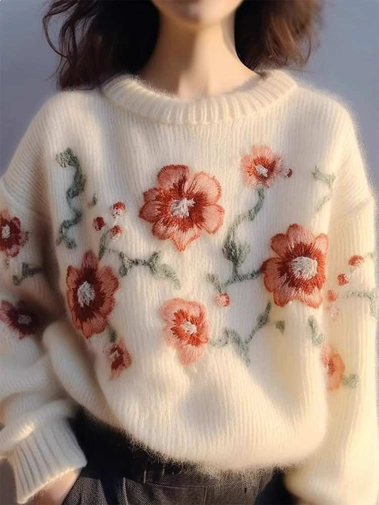 Elegancki i wygodny sweter w kolorze morelowym z okrągłym dekoltem i haftowanym wzorem kwiatowym