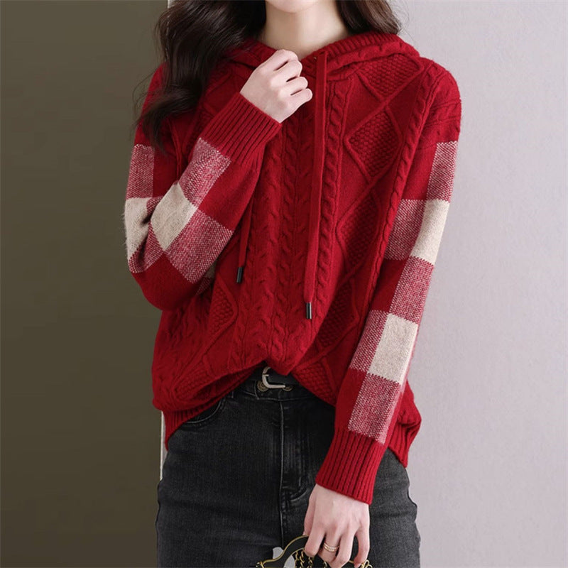 Elegancki i wygodny damski sweter z kapturem wykonany z dzianiny, ozdobiony delikatnym wzorem kwiatowym.