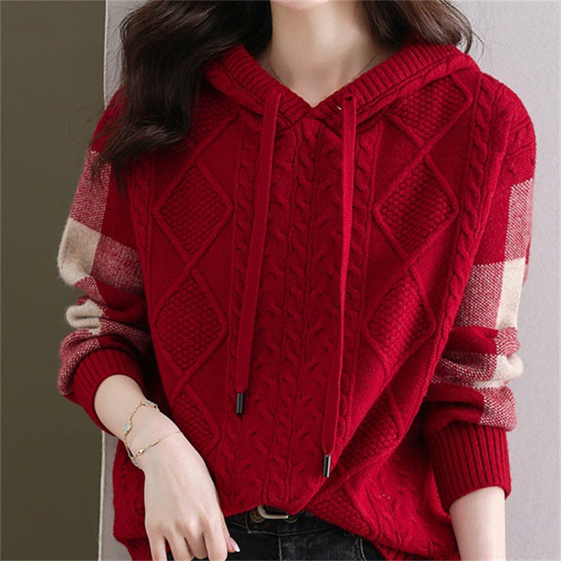 Elegancki i wygodny damski sweter z kapturem wykonany z dzianiny, ozdobiony delikatnym wzorem kwiatowym.