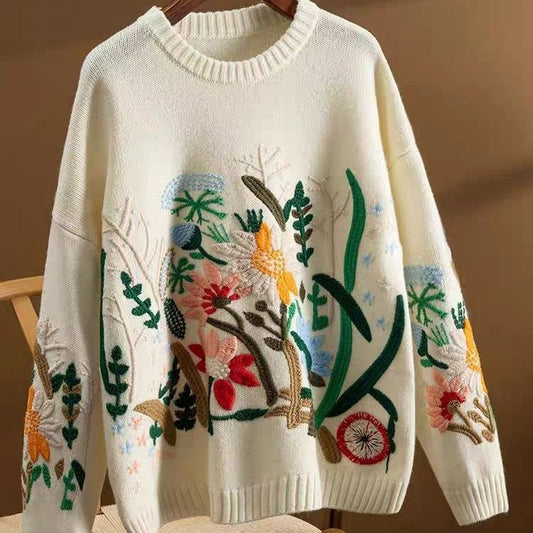 Elegancki i wygodny sweter z haftowanym kwiatowym wzorem i okrągłym dekoltem oraz długimi rękawami, który zapewnia swobodny i szykowny wygląd