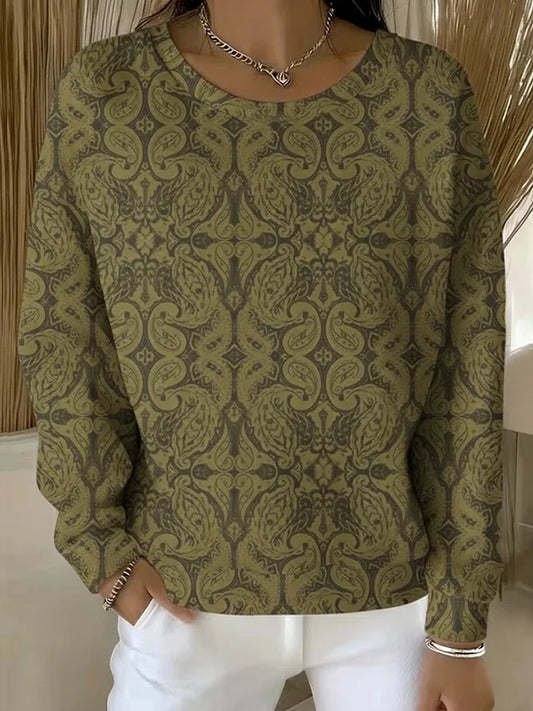 Elegancki i wygodny sweter z długim rękawem i okrągłym dekoltem, ozdobiony pięknym kwiatowym nadrukiem.
