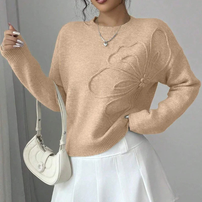 Elegancki i wygodny sweter z miękkiej wełny w jednolitym kolorze, z okrągłym dekoltem i minimalistycznym, a zarazem pięknym wzorem kwiatowym.