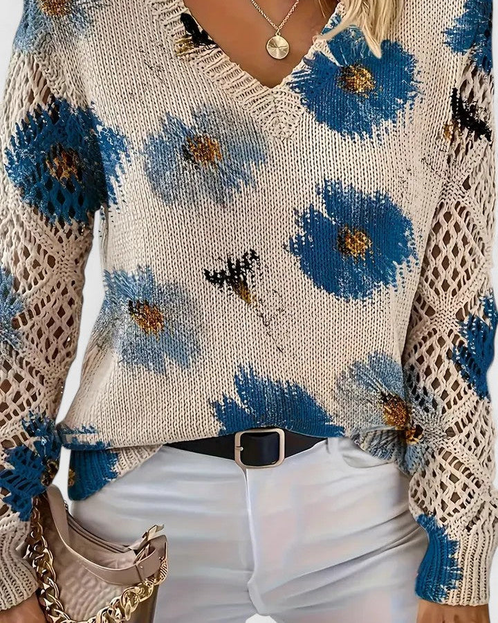 Elegancki i luksusowy top sweter dzianinowy w stylu boho z kwiatowym wzorem, dekoltem w serek, długimi rękawami i ażurowymi rękawami.