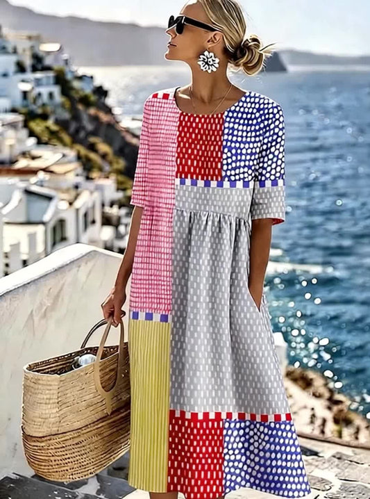 Ta luźna, wygodna, jaskrawo kolorowa sukienka z okrągłym dekoltem w bloki kolorystyczne jest wykonana z mieszanki bawełny i lnu i ma kieszenie.