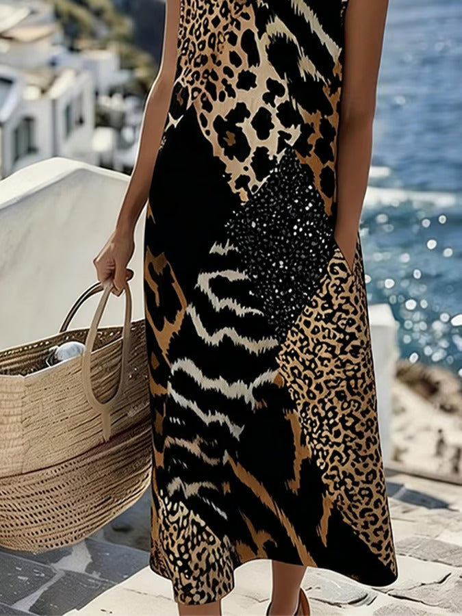 Ta elegancka i wygodna czarna sukienka bez rękawów ozdobiona jest wzorem w panterkę, który podkreśla wyrafinowany i elegancki styl.