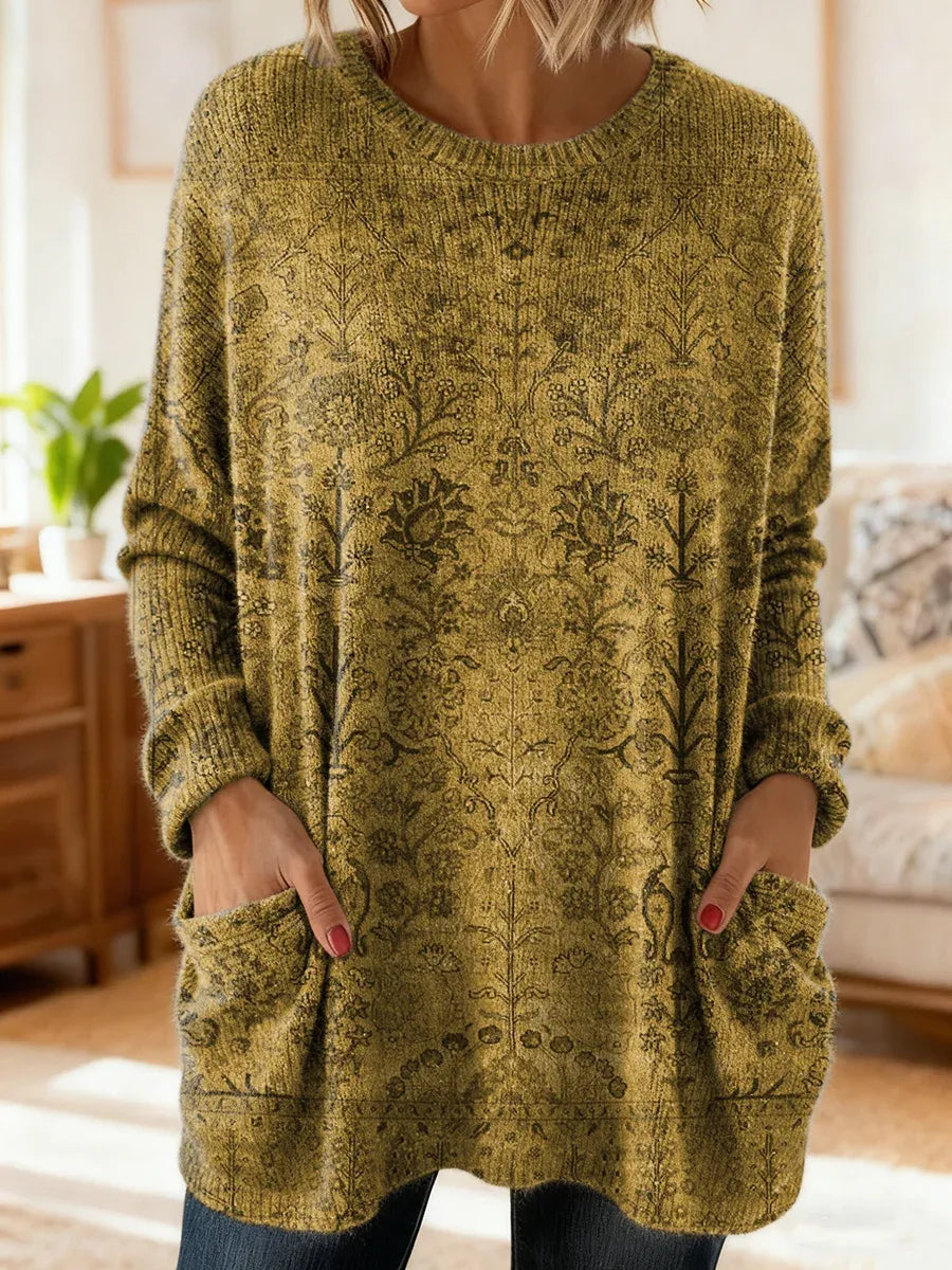 Elegancki i wygodny sweter kaszmirowy z kwiatowym nadrukiem, okrągłym dekoltem i kieszeniami.