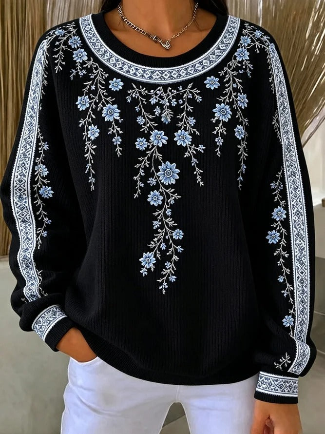 Ten sweter z okrągłym dekoltem jest elegancki i wygodny, ozdobiony delikatnym kwiatowym wzorem i ma swobodny, uniwersalny styl.