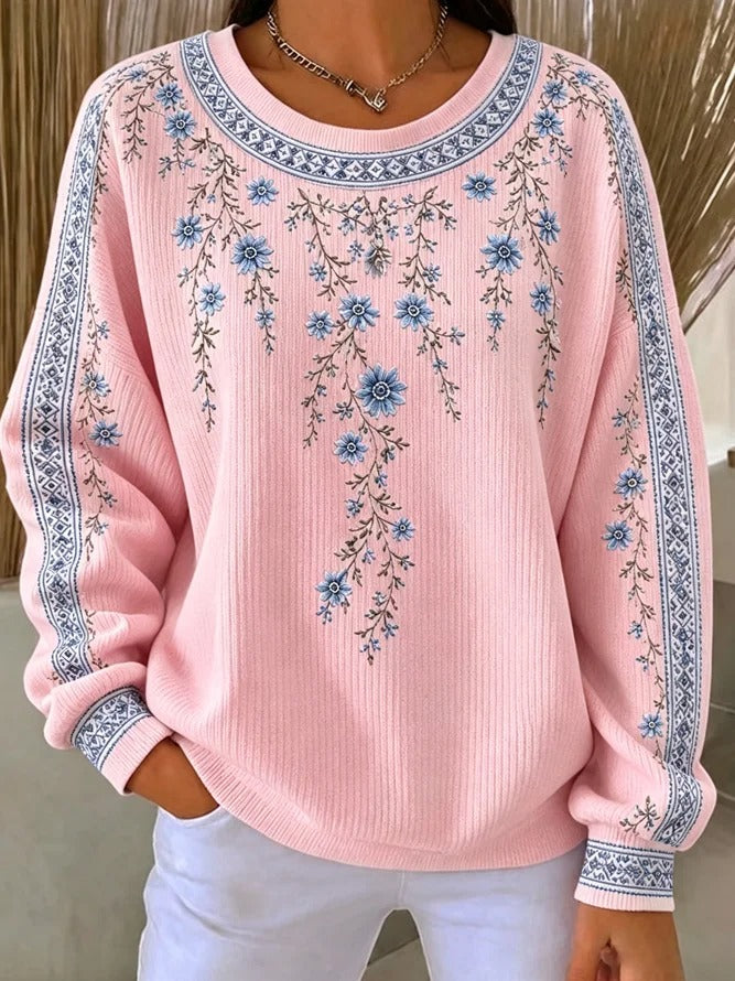 Ten sweter z okrągłym dekoltem jest elegancki i wygodny, ozdobiony delikatnym kwiatowym wzorem i ma swobodny, uniwersalny styl.