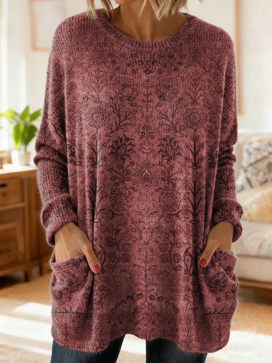 Elegancki i wygodny sweter kaszmirowy z kwiatowym nadrukiem, okrągłym dekoltem i kieszeniami.