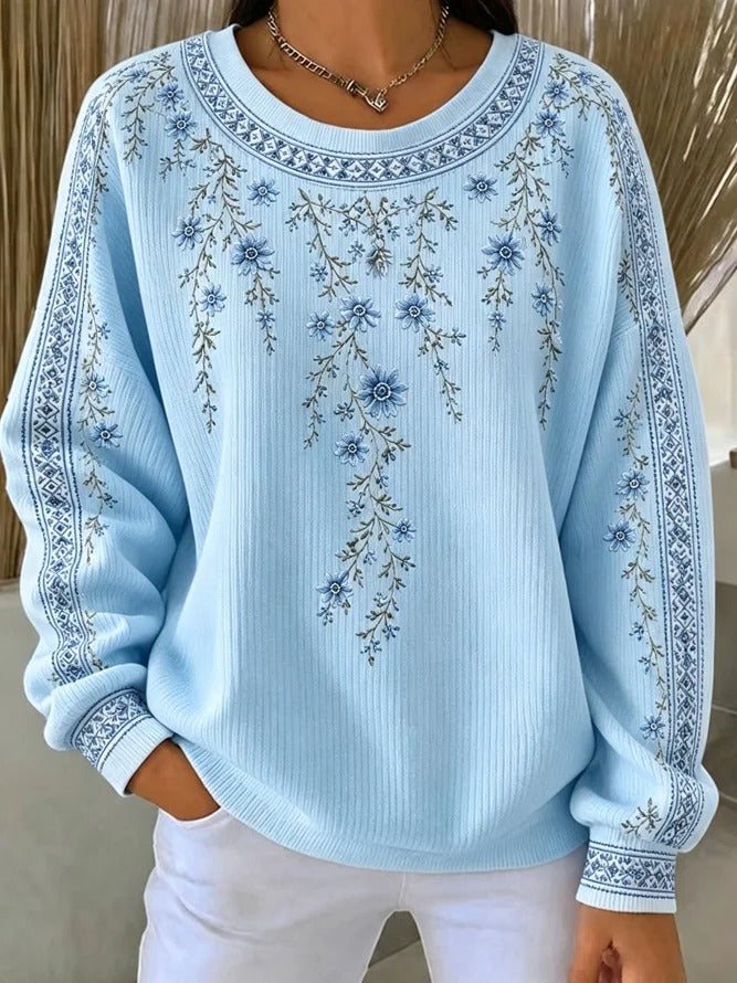Ten sweter z okrągłym dekoltem jest elegancki i wygodny, ozdobiony delikatnym kwiatowym wzorem i ma swobodny, uniwersalny styl.