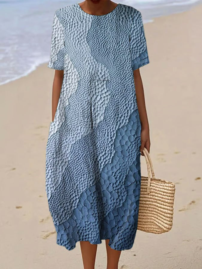 Elegancka i wygodna sukienka z krótkim rękawem w kolorowym gradiencie, lekka i zwiewna.