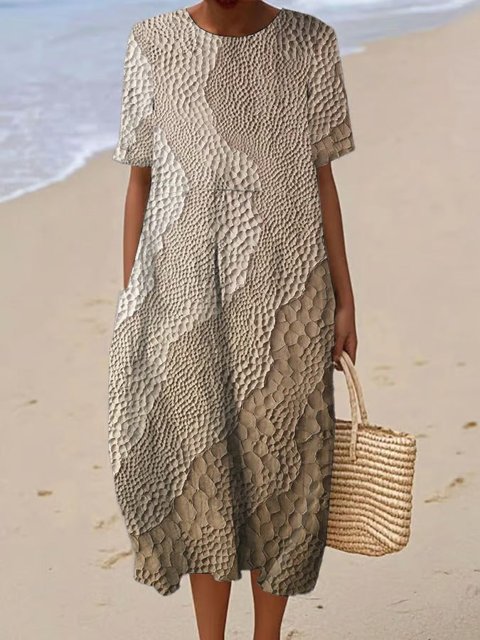 Elegancka i wygodna sukienka z krótkim rękawem w kolorowym gradiencie, lekka i zwiewna.