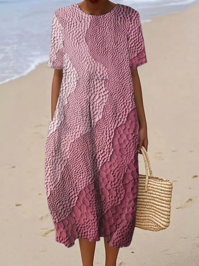 Elegancka i wygodna sukienka z krótkim rękawem w kolorowym gradiencie, lekka i zwiewna.