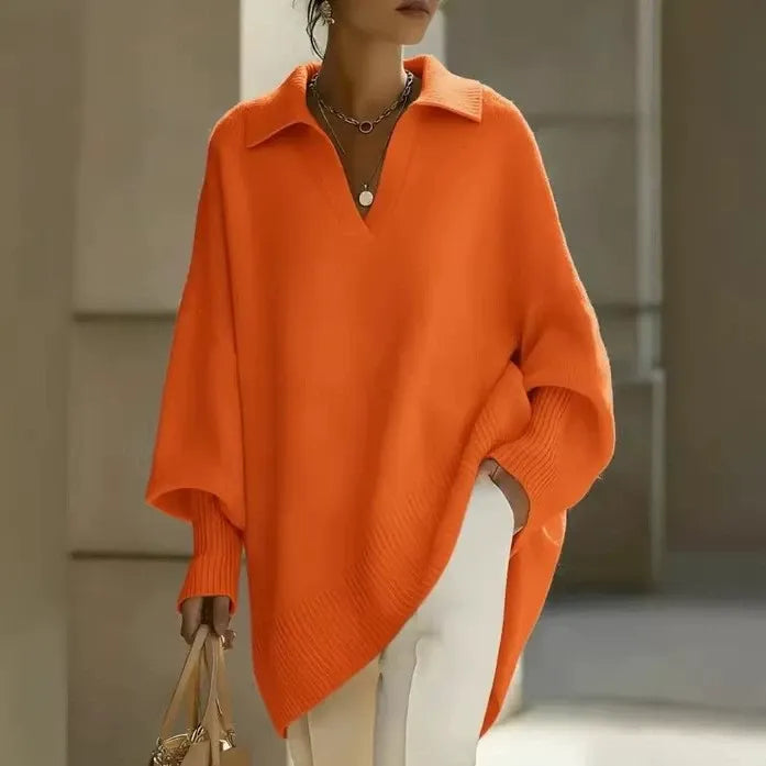 Ten elegancki, jednokolorowy sweter z kołnierzykiem ma dopasowane mankiety, które są zarówno uniwersalne, jak i wygodne.