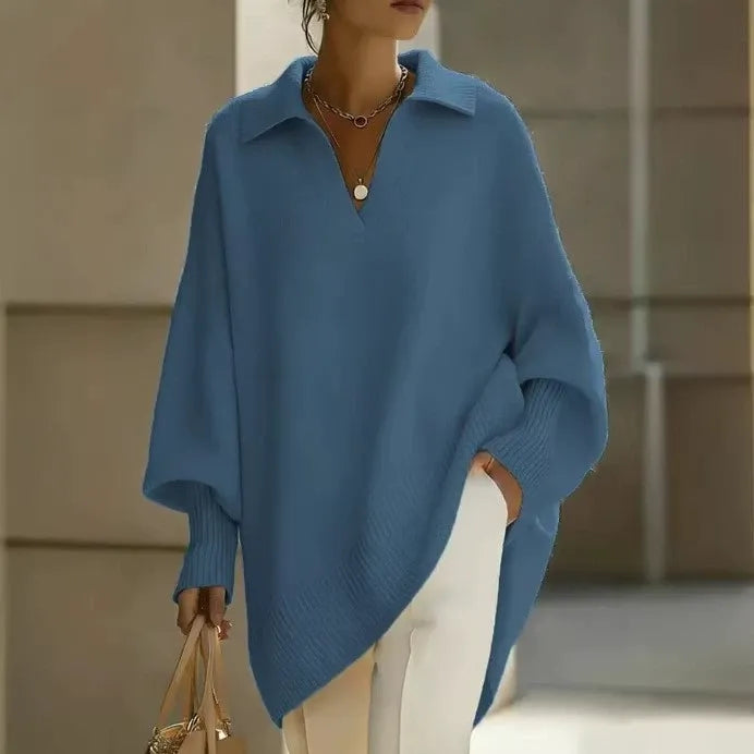 Ten elegancki, jednokolorowy sweter z kołnierzykiem ma dopasowane mankiety, które są zarówno uniwersalne, jak i wygodne.