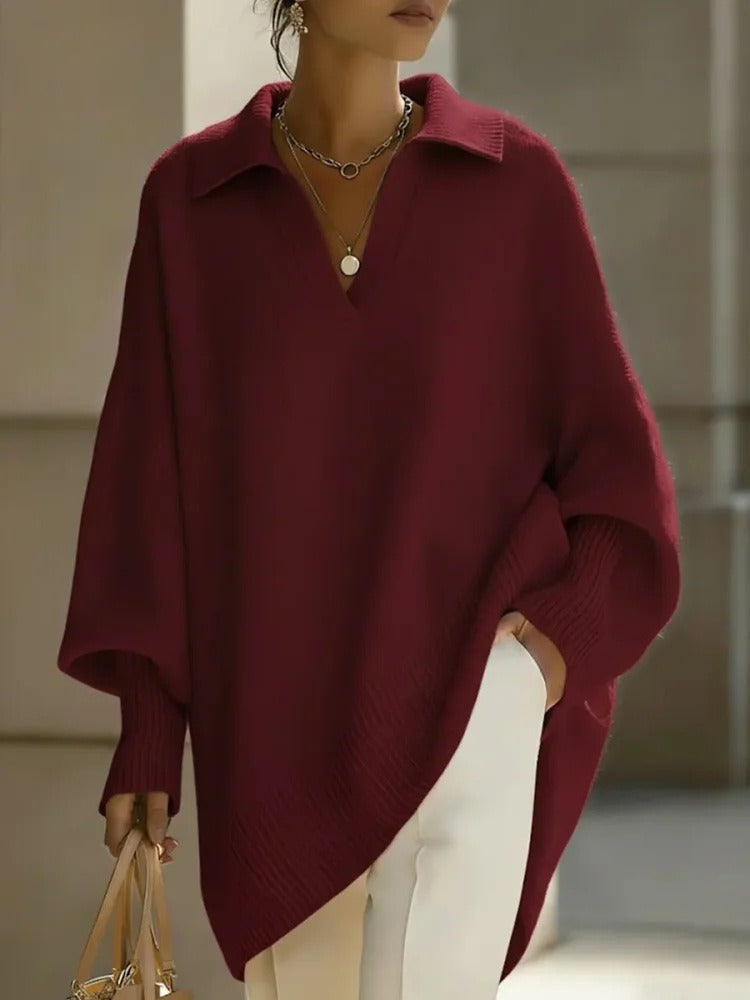 Ten elegancki, jednokolorowy sweter z kołnierzykiem ma dopasowane mankiety, które są zarówno uniwersalne, jak i wygodne.