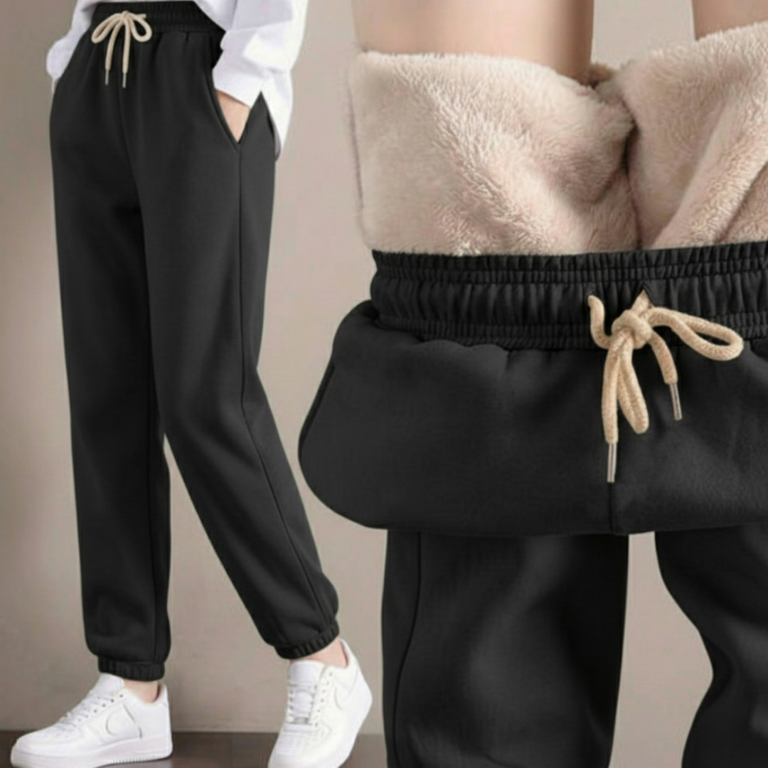 Te eleganckie i wygodne damskie spodnie dresowe o swobodnym kroju są wykonane z grubej wełnianej tkaniny i idealnie nadają się do noszenia jesienią i zimą.