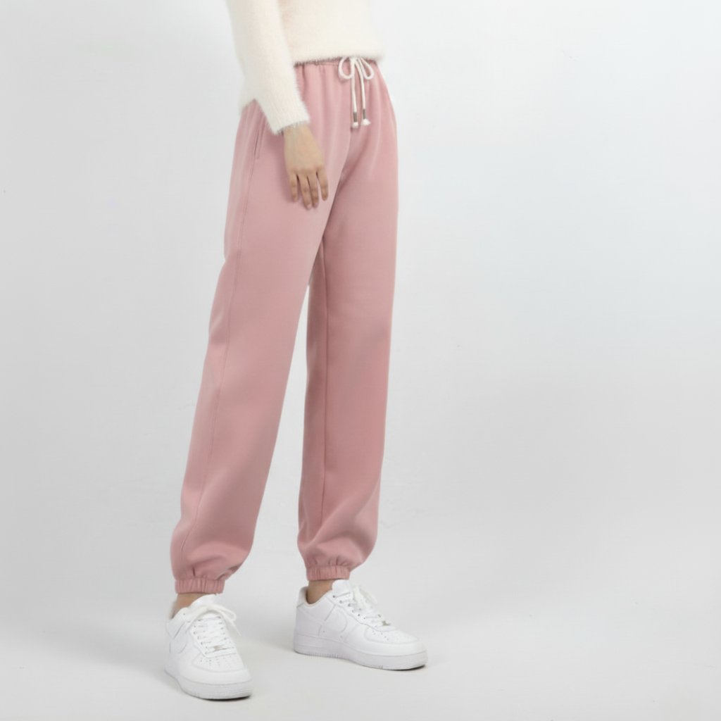 Te eleganckie i wygodne damskie spodnie dresowe o swobodnym kroju są wykonane z grubej wełnianej tkaniny i idealnie nadają się do noszenia jesienią i zimą.